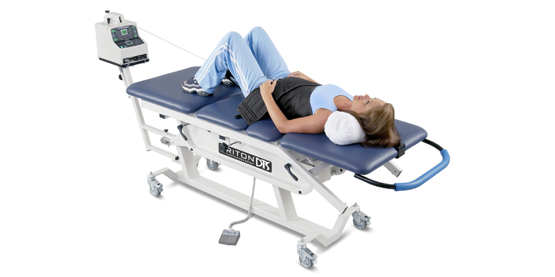 Patient receiving non-surgical spinal decompression therapy at Total Health Chiropractic in Coralville, Iowa